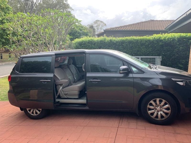 Our Kia Carnival people mover with the sliding door open, showing the middle row.