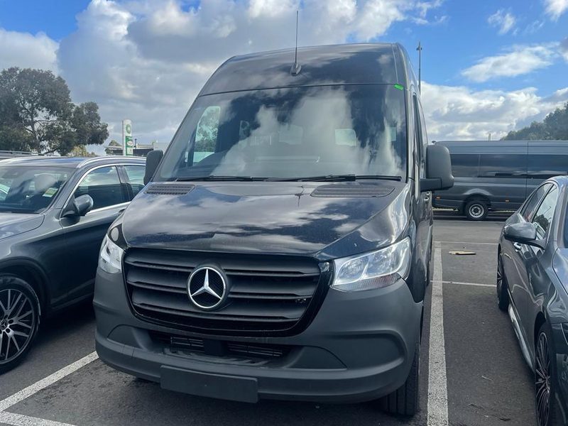 One of our Mercedes Sprinter 14-seaters, photographed from the front.