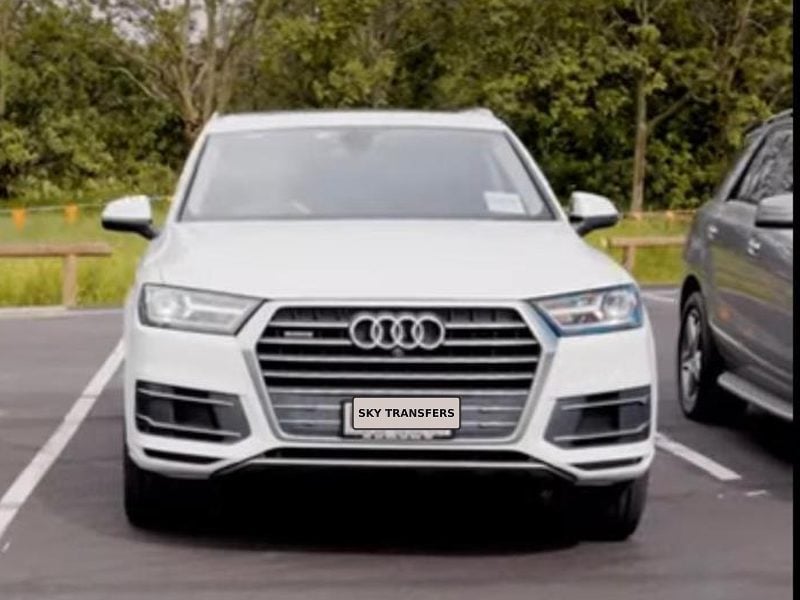 Our white Audi Q7 parked alongside the rest of the fleet.